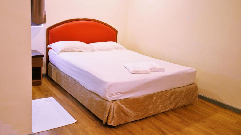 Postel nebo postele na pokoji v ubytování Sogo Hotel 2