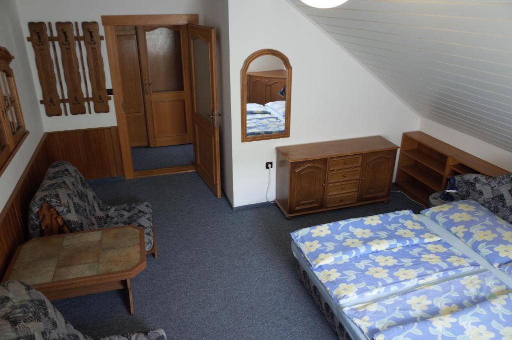Postel nebo postele na pokoji v ubytování Pension Baron