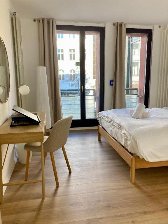 Postel nebo postele na pokoji v ubytování Minimal Hostel Kreuzberg