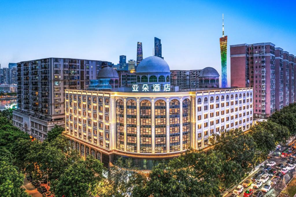 a large building in the middle of a city at Atour Hotel Canton Tower Pearl River Binjiang Road East Guangzhou - Free Shuttle Bus Service Between Fair And Hotel During The Canton Fair in Guangzhou