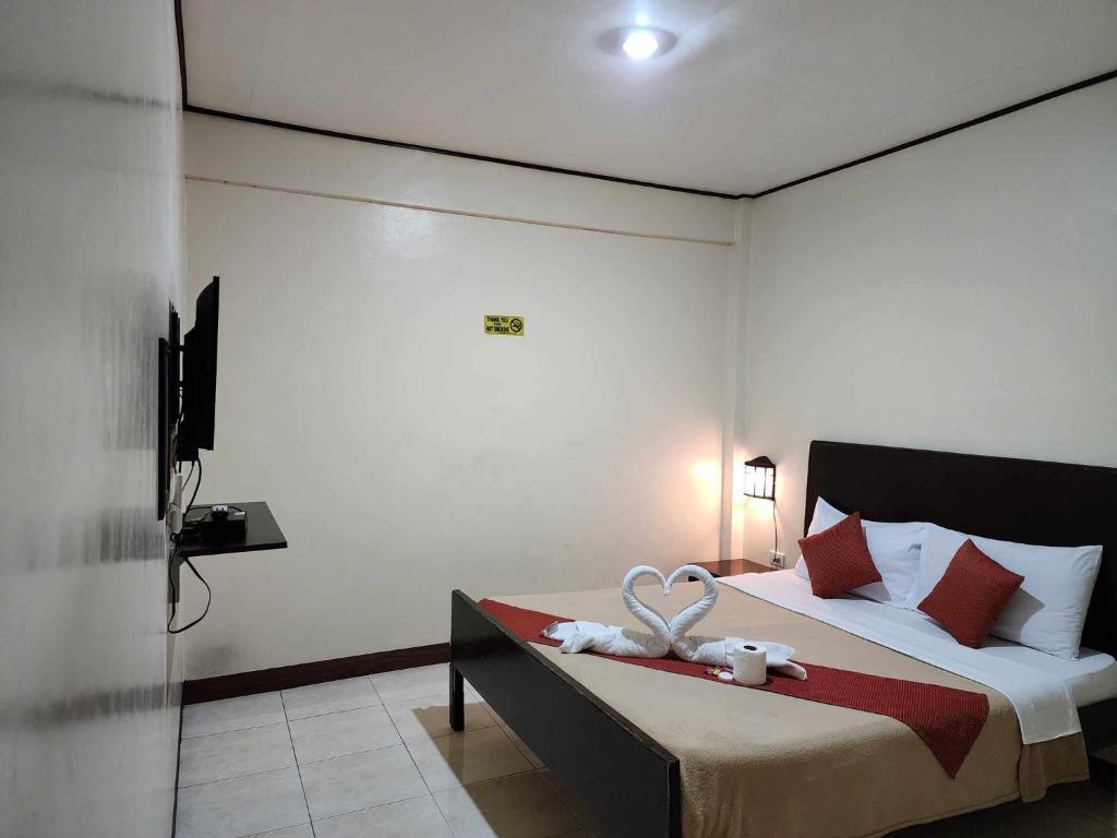 Postel nebo postele na pokoji v ubytování Elegance Guesthouse