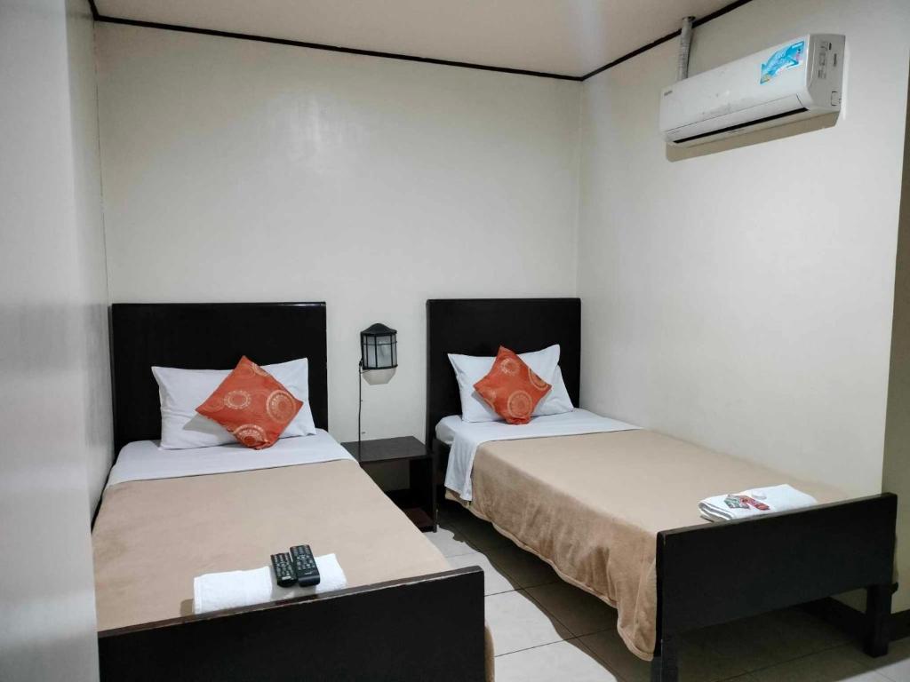 Postel nebo postele na pokoji v ubytování Elegance Guesthouse