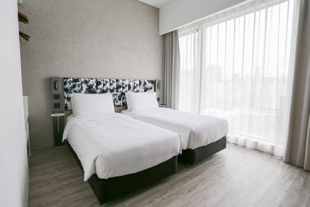 Letto o letti in una camera di Page148, Page Hotels