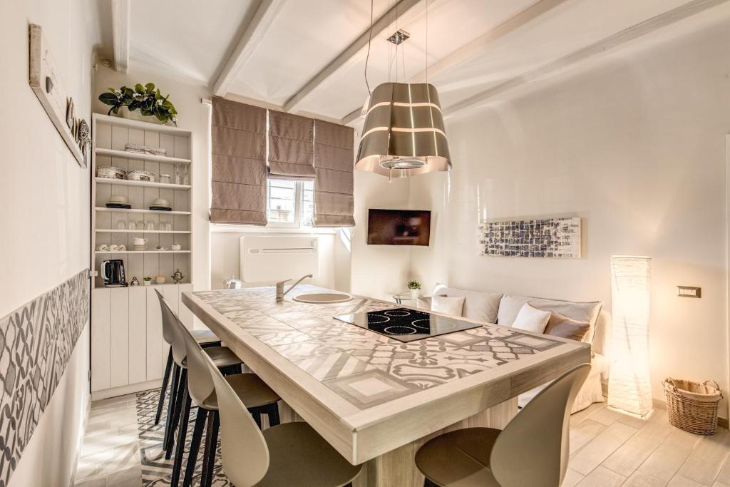 a kitchen with a large marble table and chairs at Vatican Sweet Home in Rome