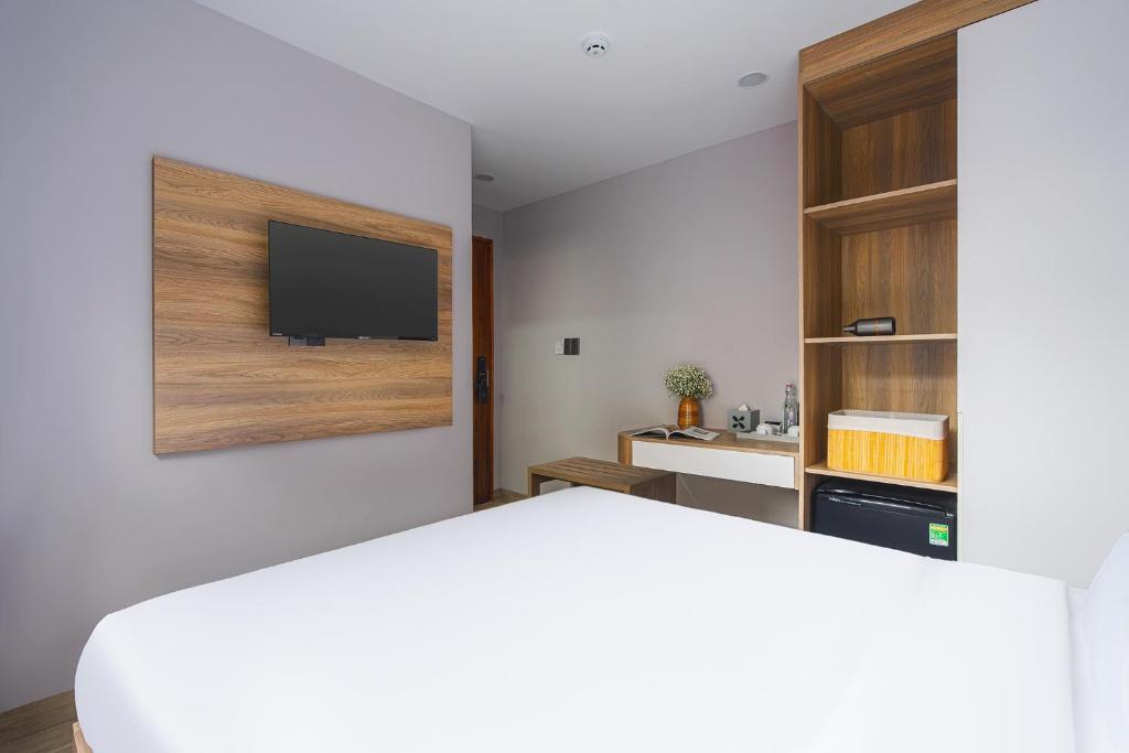 Giường trong phòng chung tại Nature Hotel - Win Happy