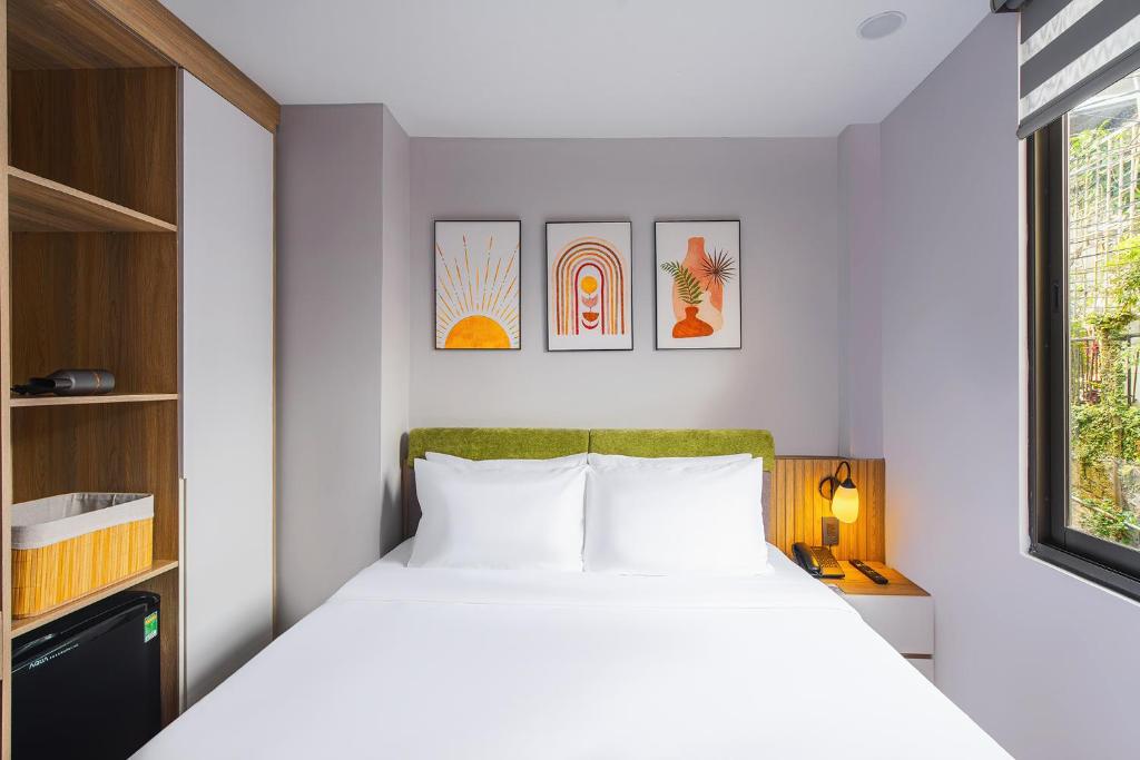 Giường trong phòng chung tại Nature Hotel - Win Happy