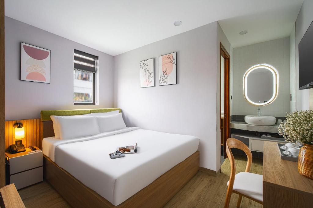 Giường trong phòng chung tại Nature Hotel - Win Happy