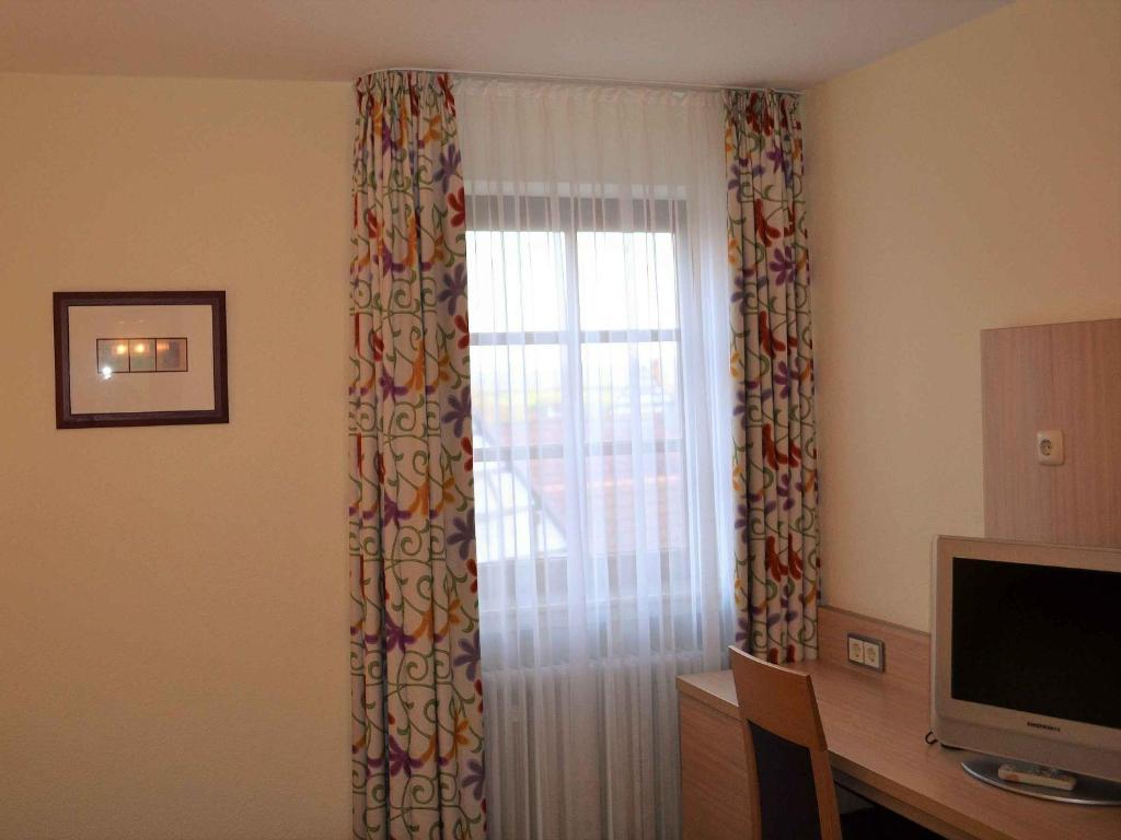 TV a/nebo společenská místnost v ubytování Hotel-Gasthof Rotes Roß