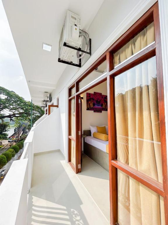 Postel nebo postele na pokoji v ubytování The Kandy Havens