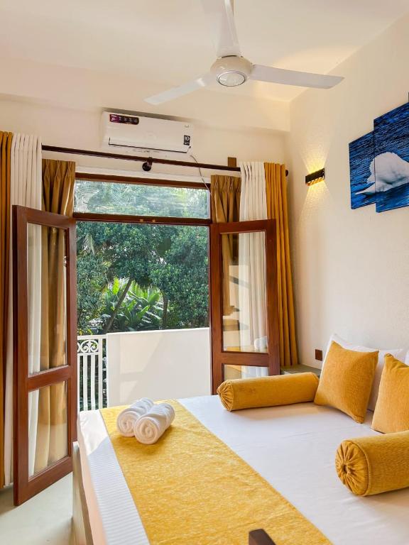 Postel nebo postele na pokoji v ubytování The Kandy Havens