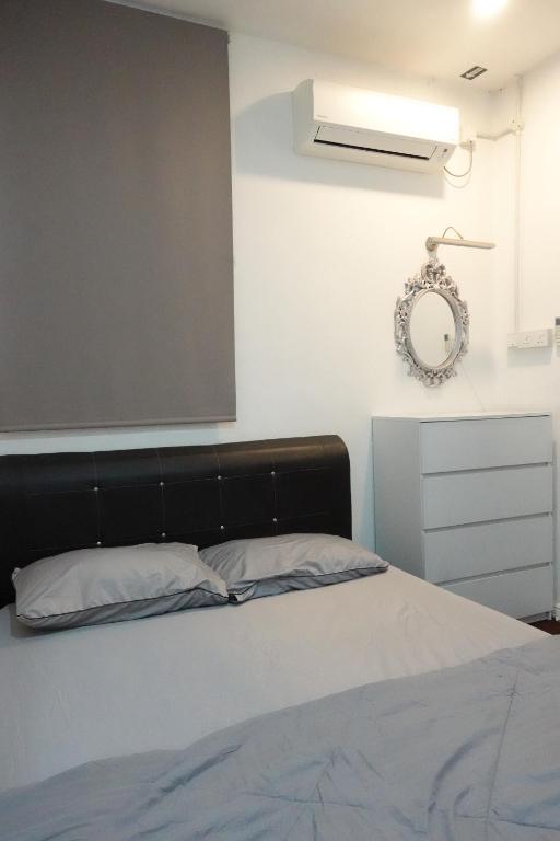 Voodi või voodid majutusasutuse ManMai Homestay Double Storey toas