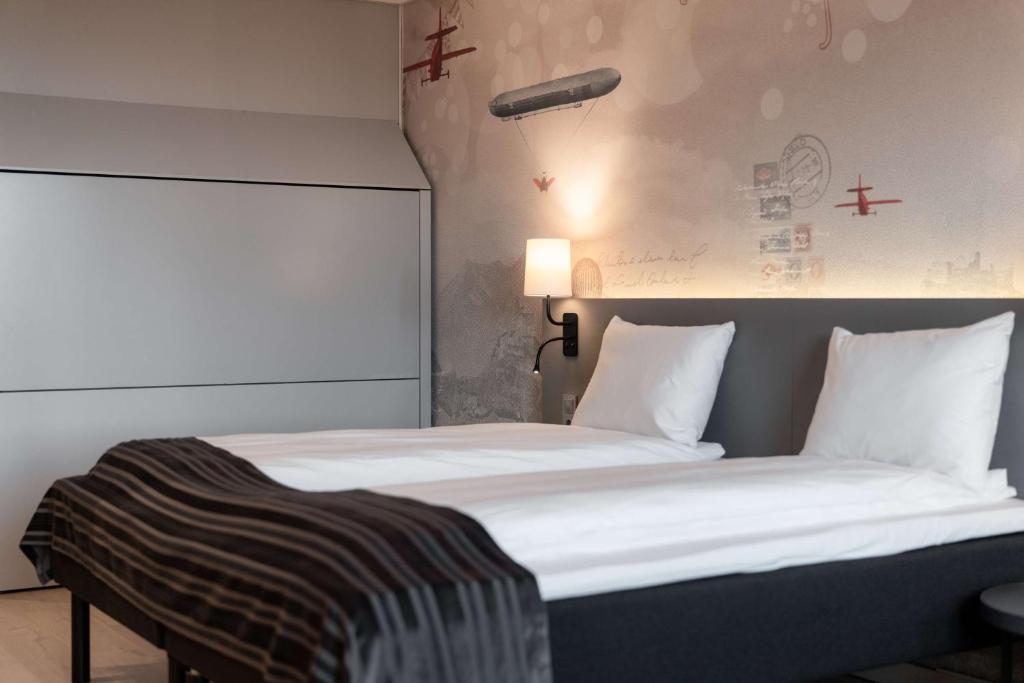 Postel nebo postele na pokoji v ubytování Scandic Byporten