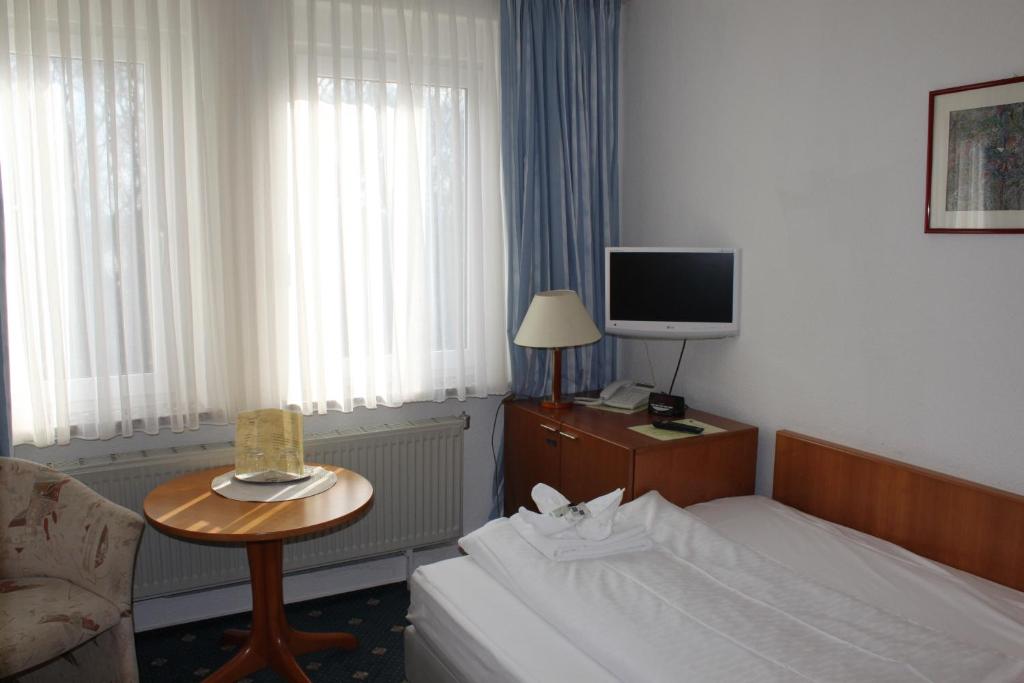 TV a/nebo společenská místnost v ubytování Kur- und Ferienhotel Sanddorn