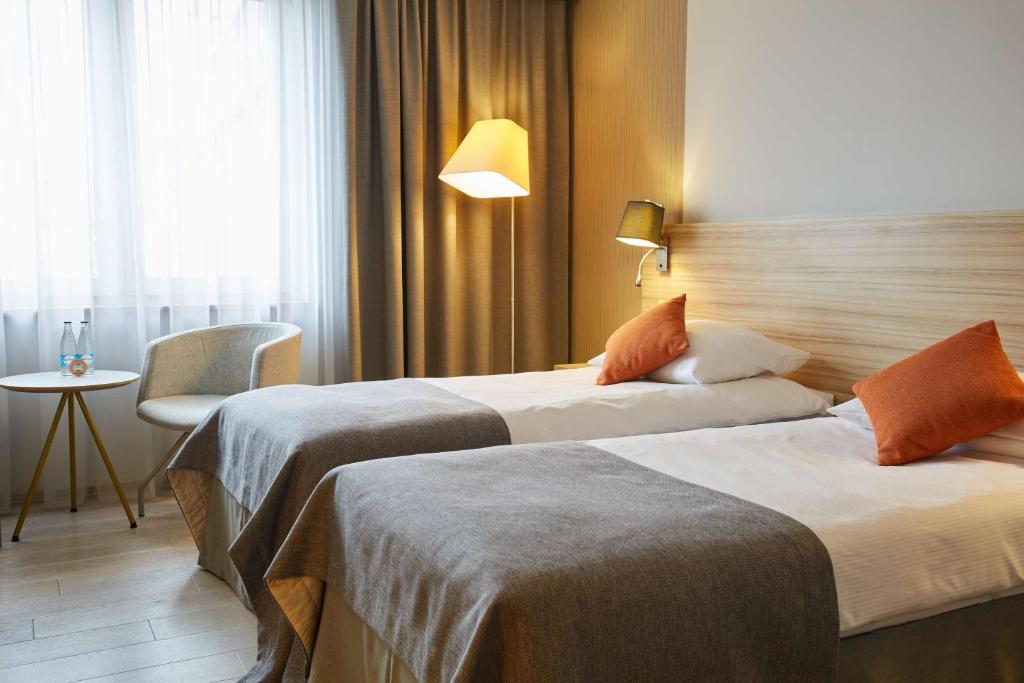 Postel nebo postele na pokoji v ubytování Scandic Wrocław