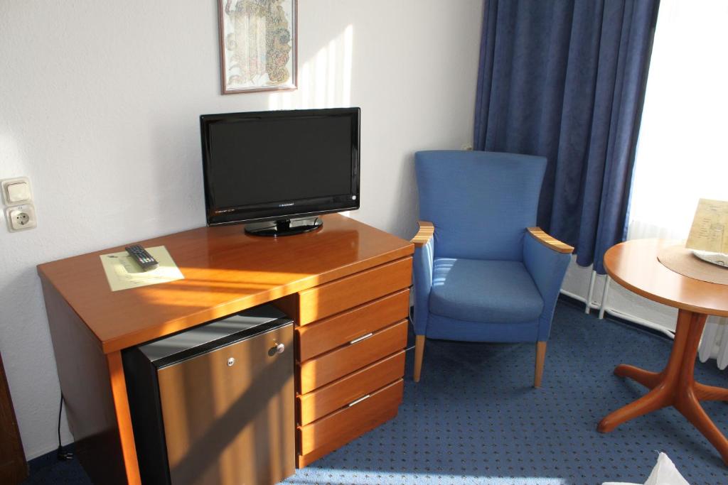 TV a/nebo společenská místnost v ubytování Kur- und Ferienhotel Sanddorn