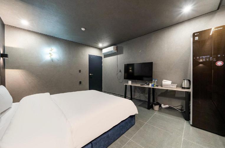 Postel nebo postele na pokoji v ubytování Moonstay Hotel Cheonan