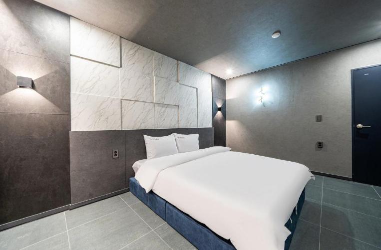 Postel nebo postele na pokoji v ubytování Moonstay Hotel Cheonan