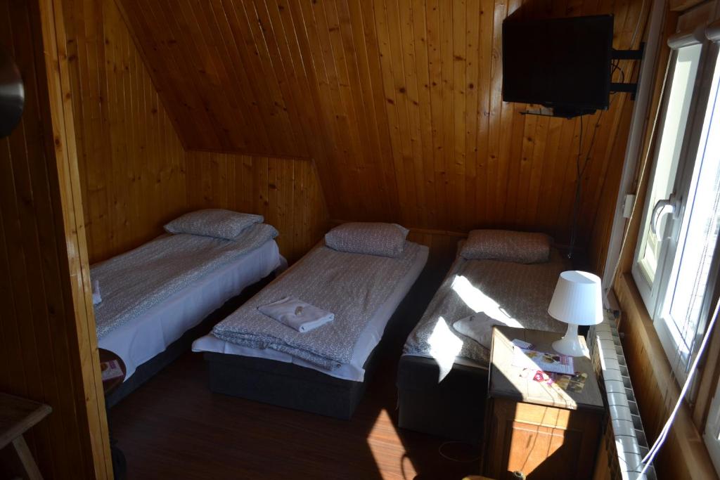Postel nebo postele na pokoji v ubytování Zajazd Orchidea