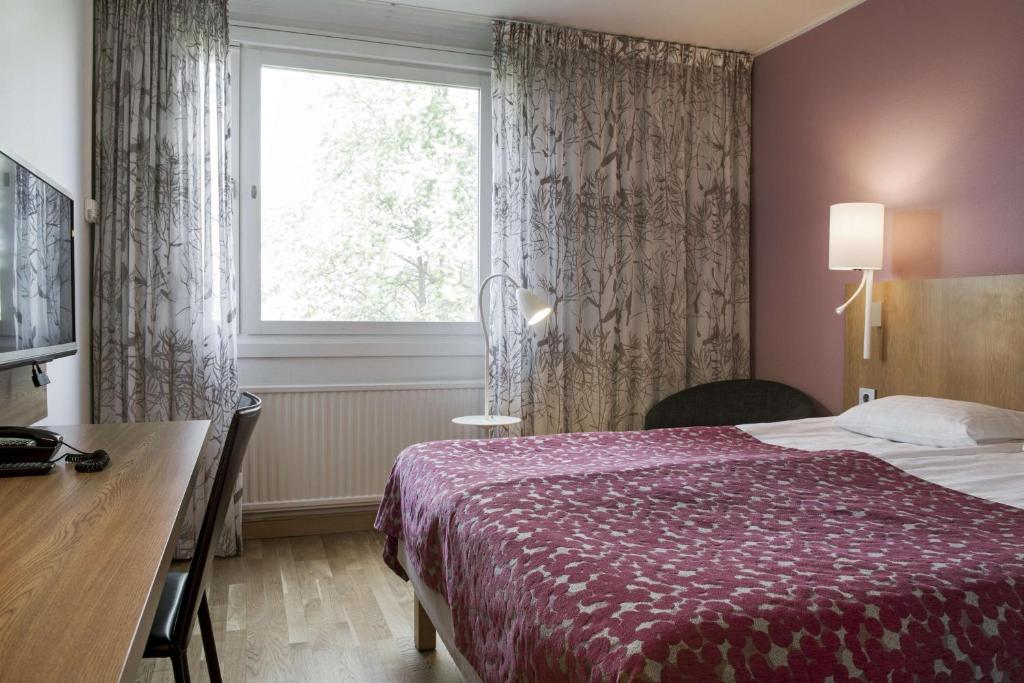 Postel nebo postele na pokoji v ubytování Scandic Norrköping Nord