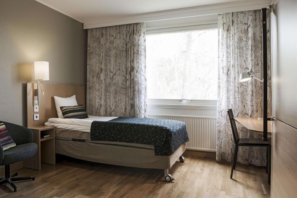 Postel nebo postele na pokoji v ubytování Scandic Norrköping Nord