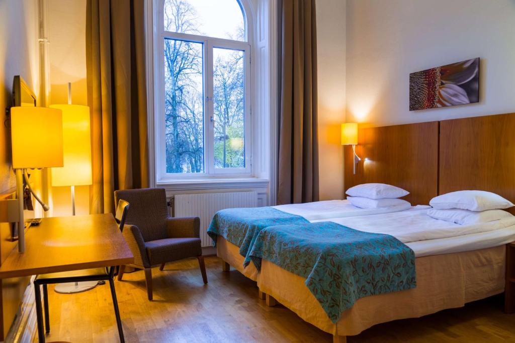 Postel nebo postele na pokoji v ubytování Scandic Billingen