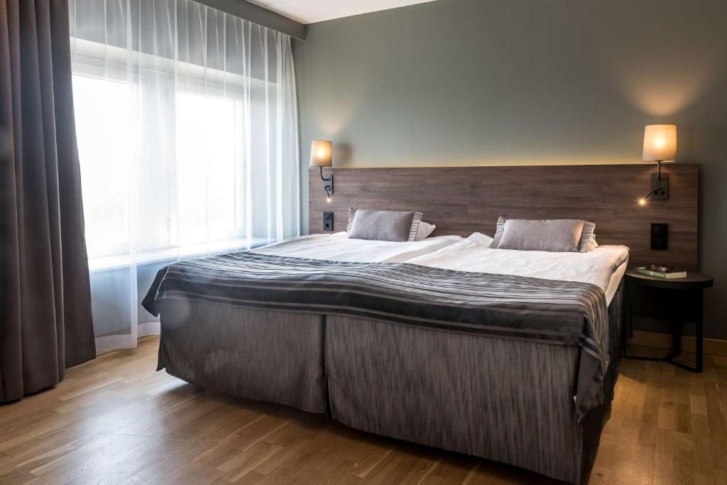 Postel nebo postele na pokoji v ubytování Scandic Infra City