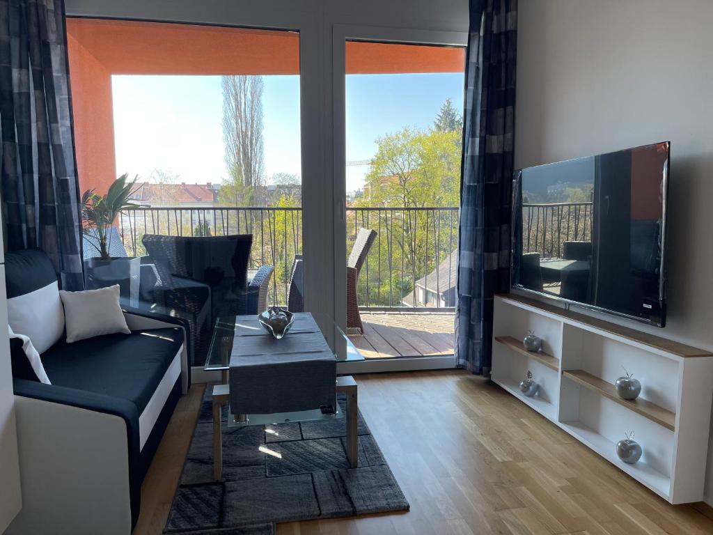 TV a/nebo společenská místnost v ubytování Apartment in der Nähe vom Lendplatz