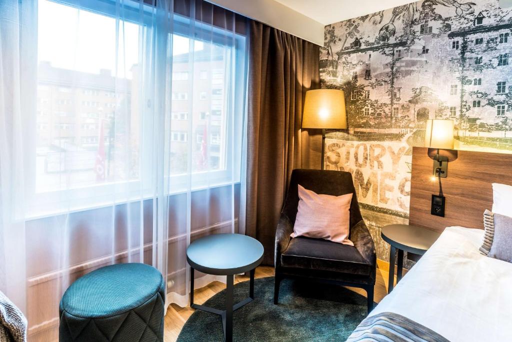 Postel nebo postele na pokoji v ubytování Scandic Grand Hotel