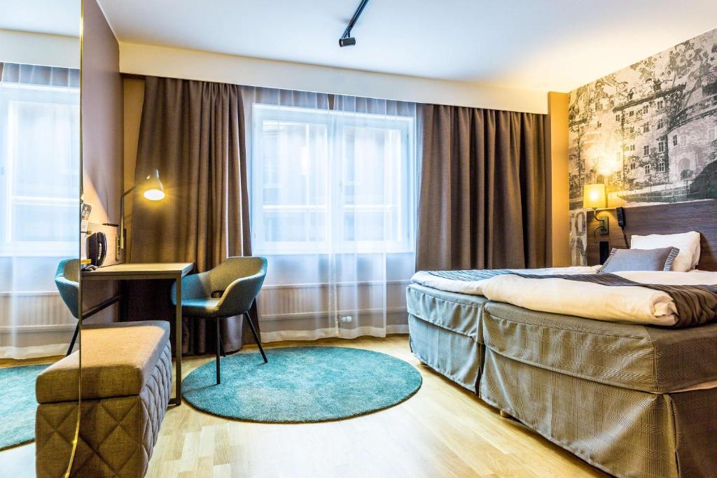 Postel nebo postele na pokoji v ubytování Scandic Grand Hotel