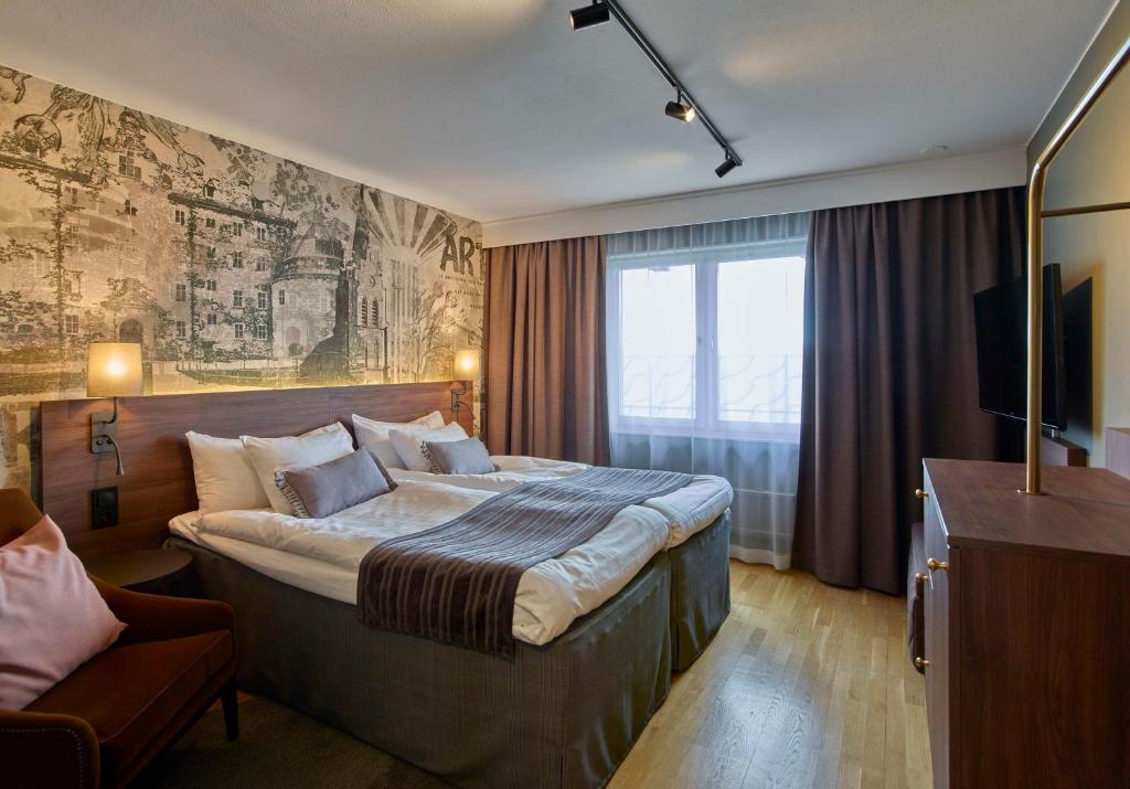 Postel nebo postele na pokoji v ubytování Scandic Grand Hotel