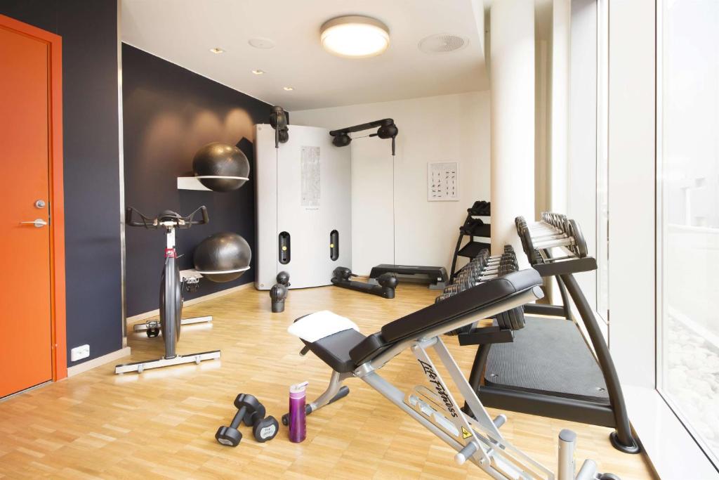 a gym with cardio equipment in a room at Scandic Stavanger Airport in Sola