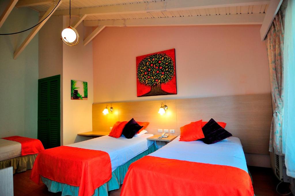 Postel nebo postele na pokoji v ubytování Hosteria Canoa