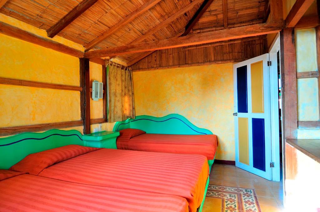 Postel nebo postele na pokoji v ubytování Hosteria Canoa