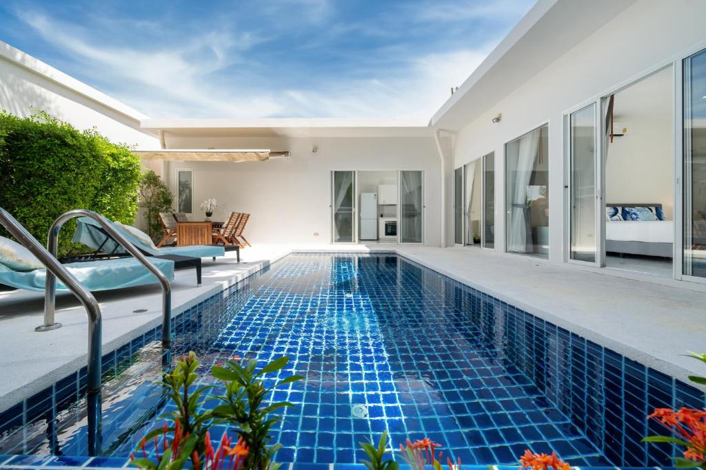 a swimming pool in the backyard of a villa at The Greens Phuket Villa with swimming pool 18 in Ban Saiyuan (1)