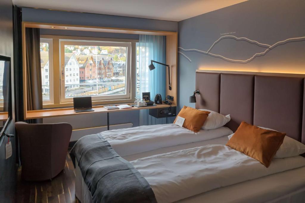 Postel nebo postele na pokoji v ubytování Scandic Ishavshotel