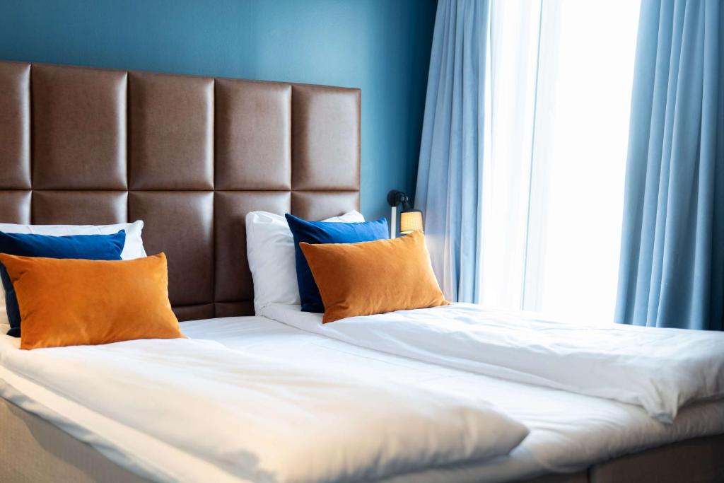 Postel nebo postele na pokoji v ubytování Scandic Ishavshotel
