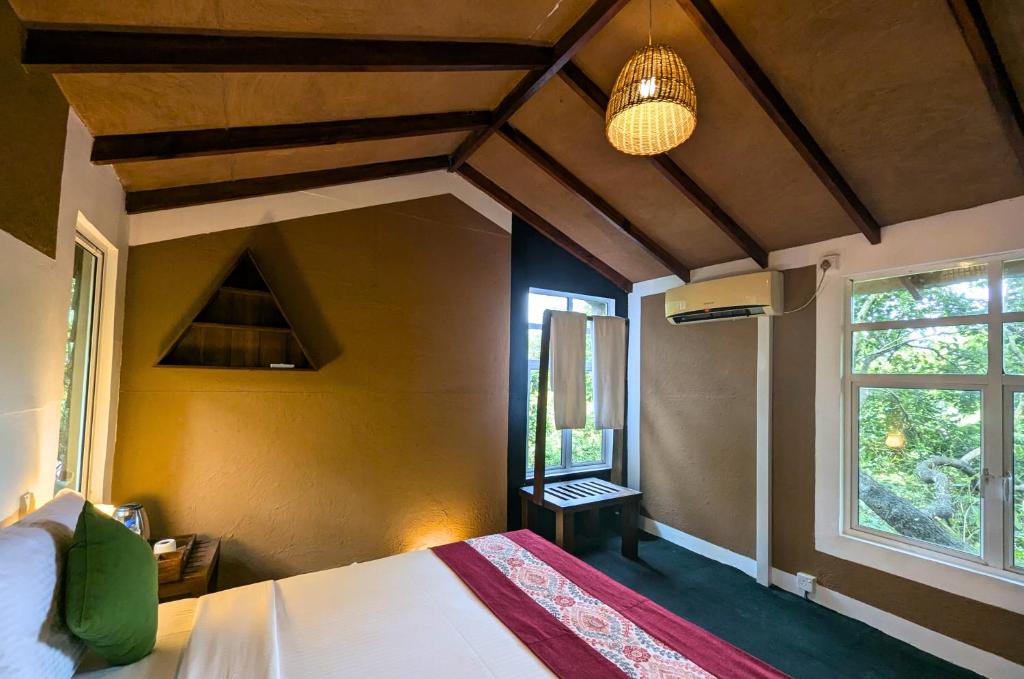 Postel nebo postele na pokoji v ubytování Pinthaliya Resort