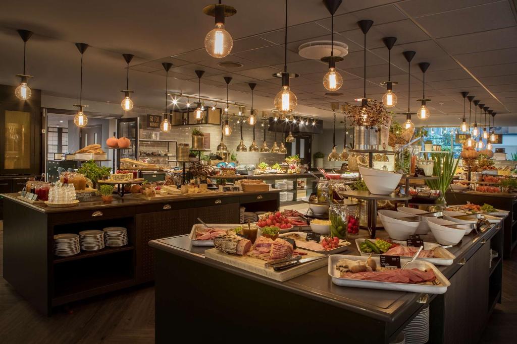 a buffet line with many different types of food at Scandic Hell in Hell