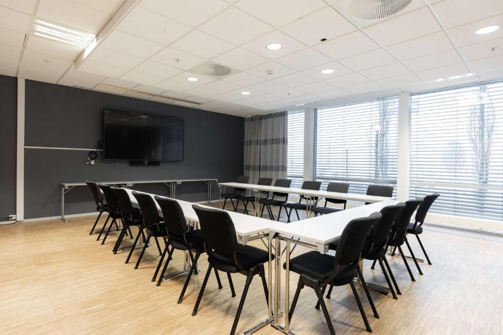 a conference room with a table and chairs at Scandic Hell in Hell