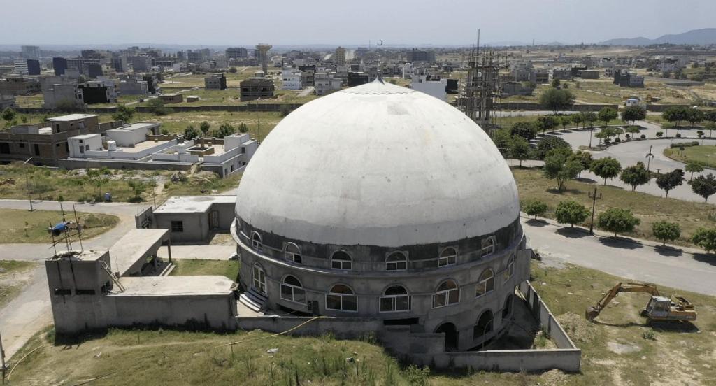 an observatory with a large white dome in a city at Haven homes in Islamabad