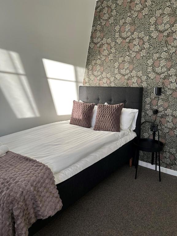 Postel nebo postele na pokoji v ubytování Grangärde Hotell