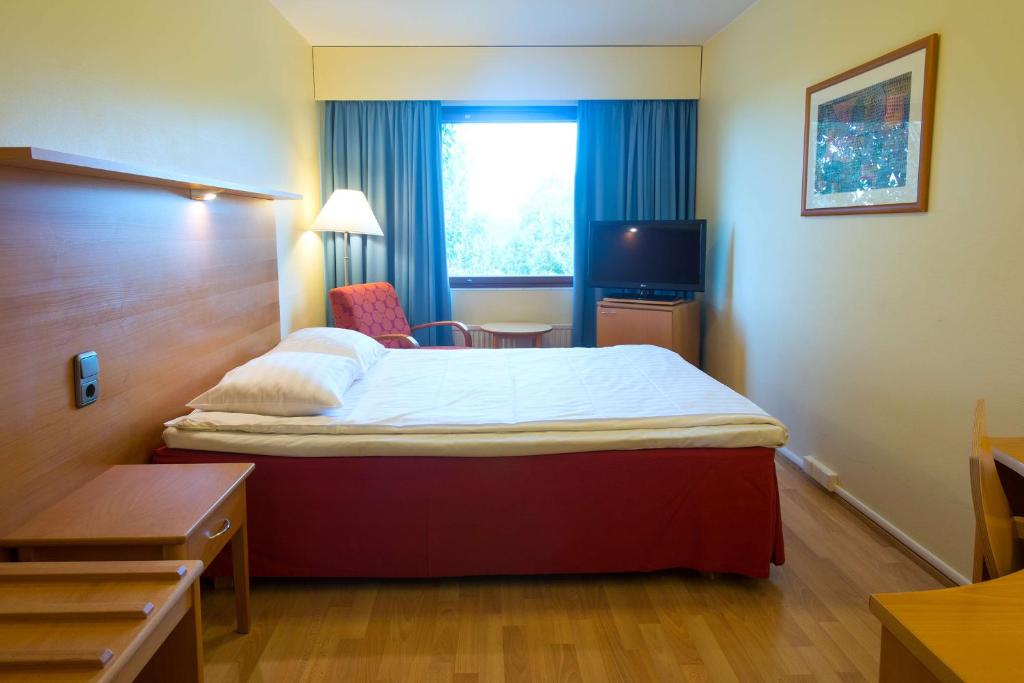 Postel nebo postele na pokoji v ubytování Scandic Kemi