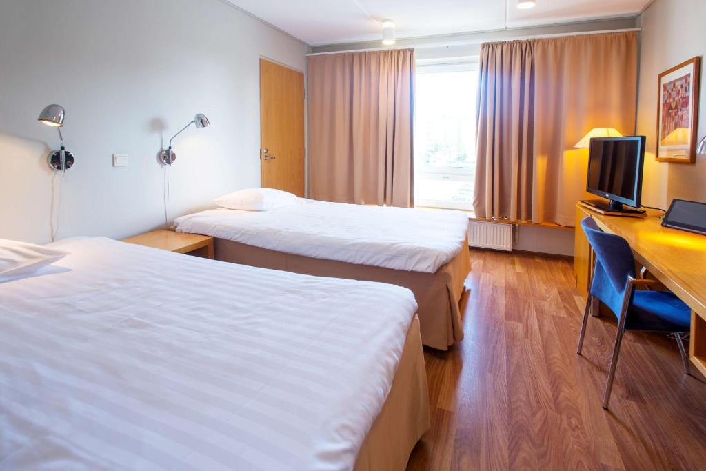 Postel nebo postele na pokoji v ubytování Scandic Kemi