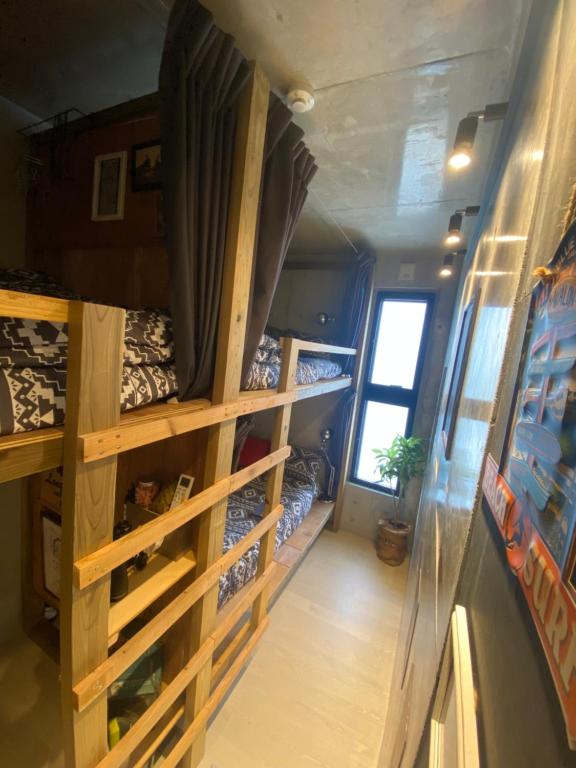 Postel nebo postele na pokoji v ubytování Sesoko Blue