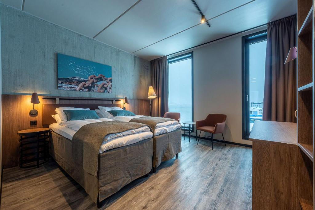 Postel nebo postele na pokoji v ubytování Scandic Sortland
