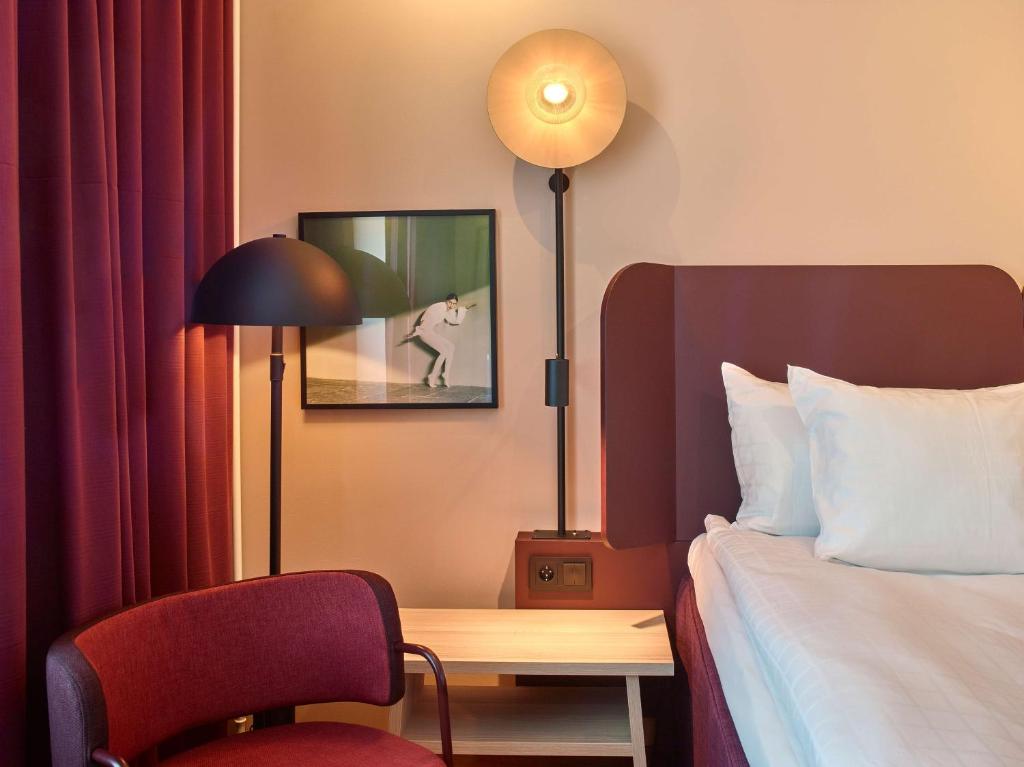 Postel nebo postele na pokoji v ubytování Scandic Kiruna