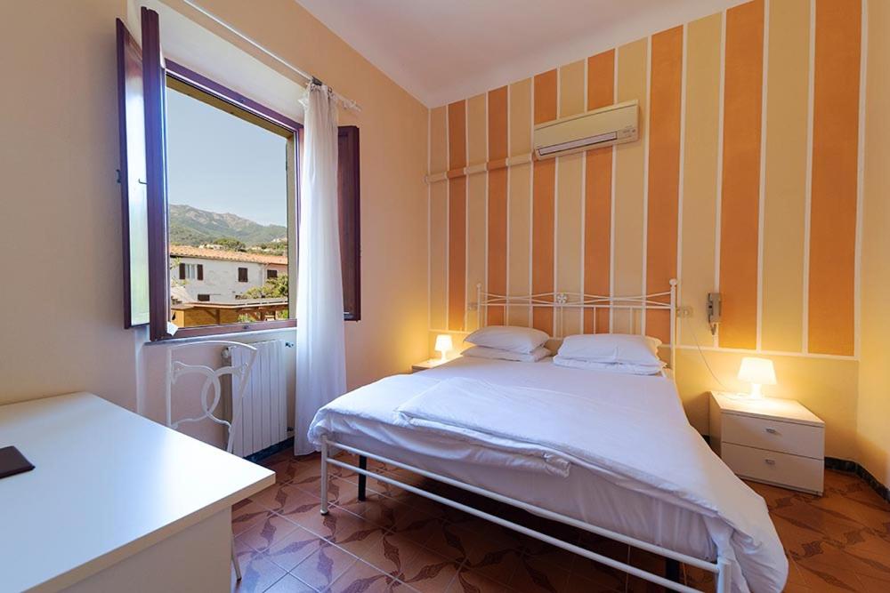 Postel nebo postele na pokoji v ubytování Hotel Casa Lupi