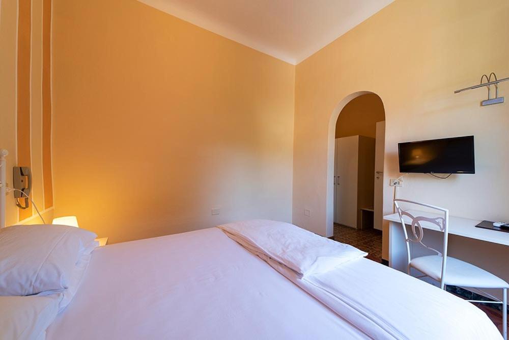 Postel nebo postele na pokoji v ubytování Hotel Casa Lupi