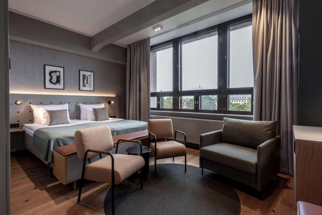 Ένα ή περισσότερα κρεβάτια σε δωμάτιο στο Scandic Helsinki Hub