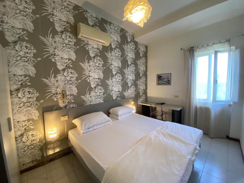 Postel nebo postele na pokoji v ubytování Hotel Casa Lupi